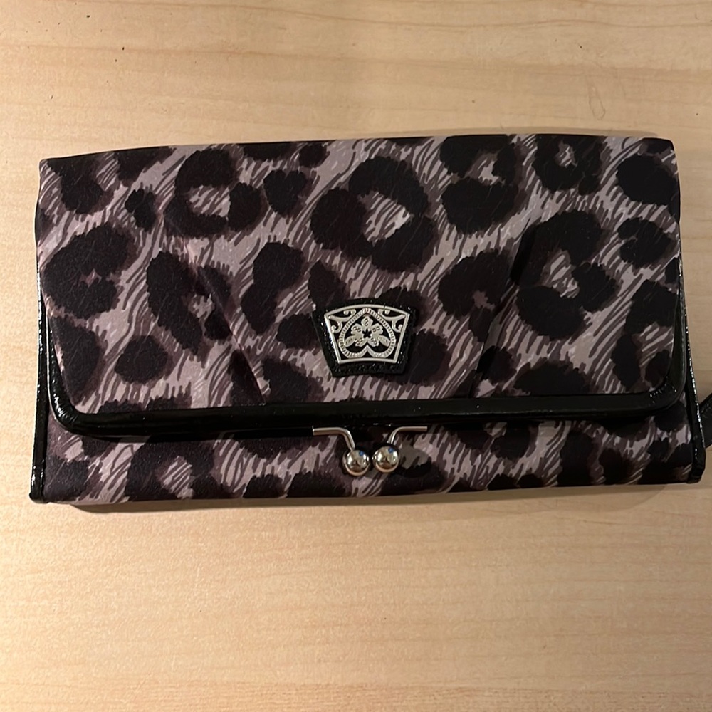 Brighton Clutch animal print. New and has magnetic clasps. Silk like material.